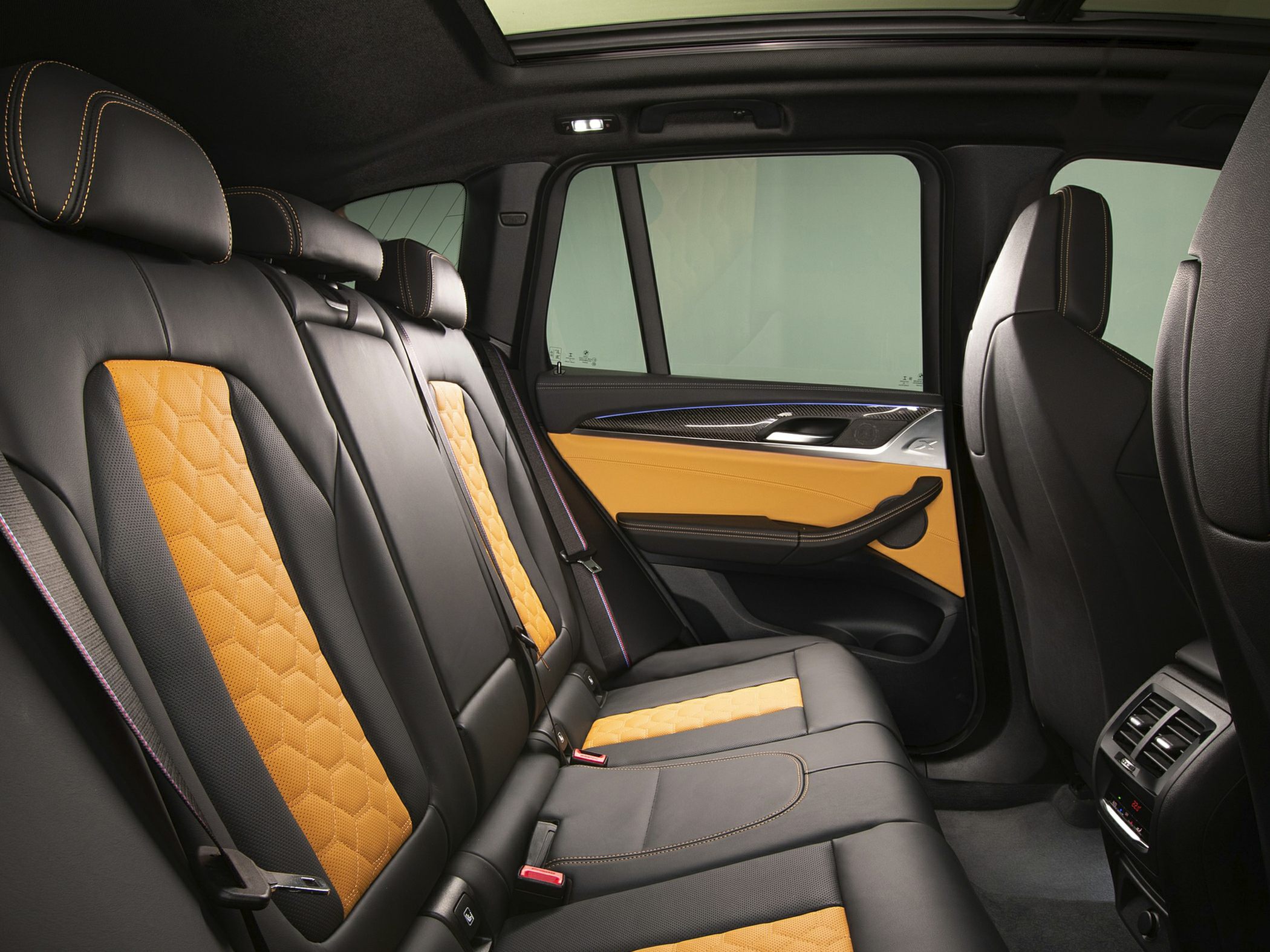 Black and orange leather quilted rear seats with carbon fiber door trim