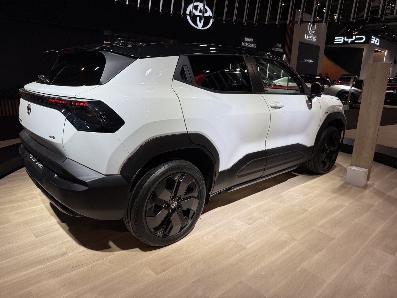 Rear side view with sleek body lines and black alloy wheels