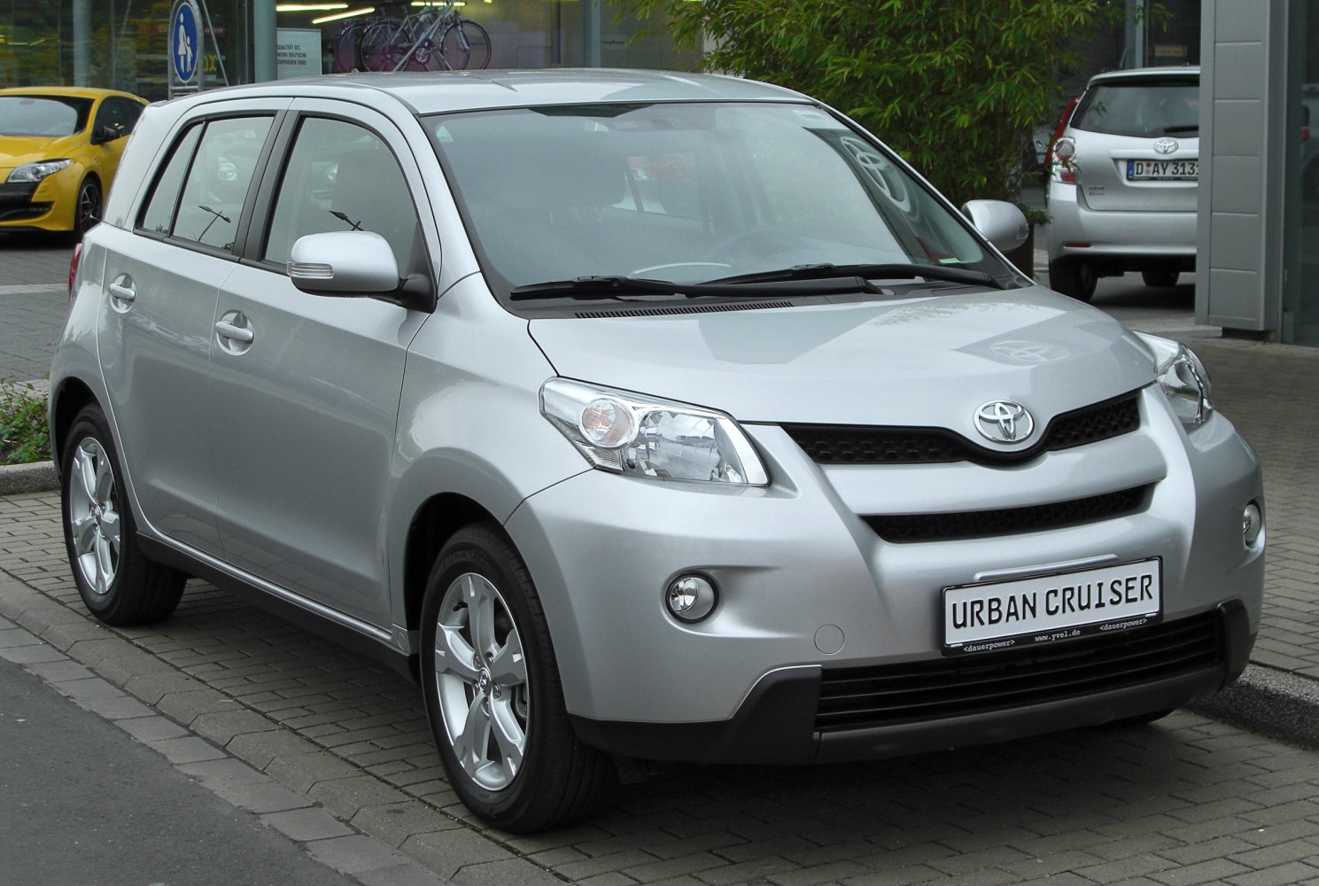 Silver compact hatchback SUV front three-quarter view with alloy wheels.
