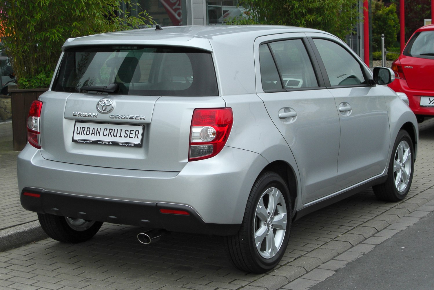 Rear view of silver compact hatchback with distinctive taillights and alloy wheels