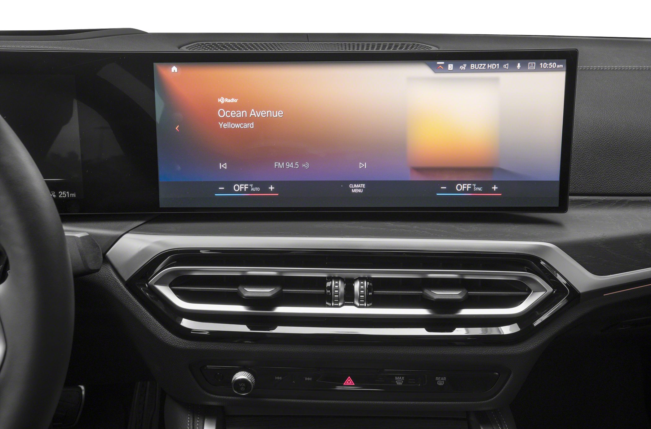 Wide digital touchscreen display and hexagonal air vents in dashboard