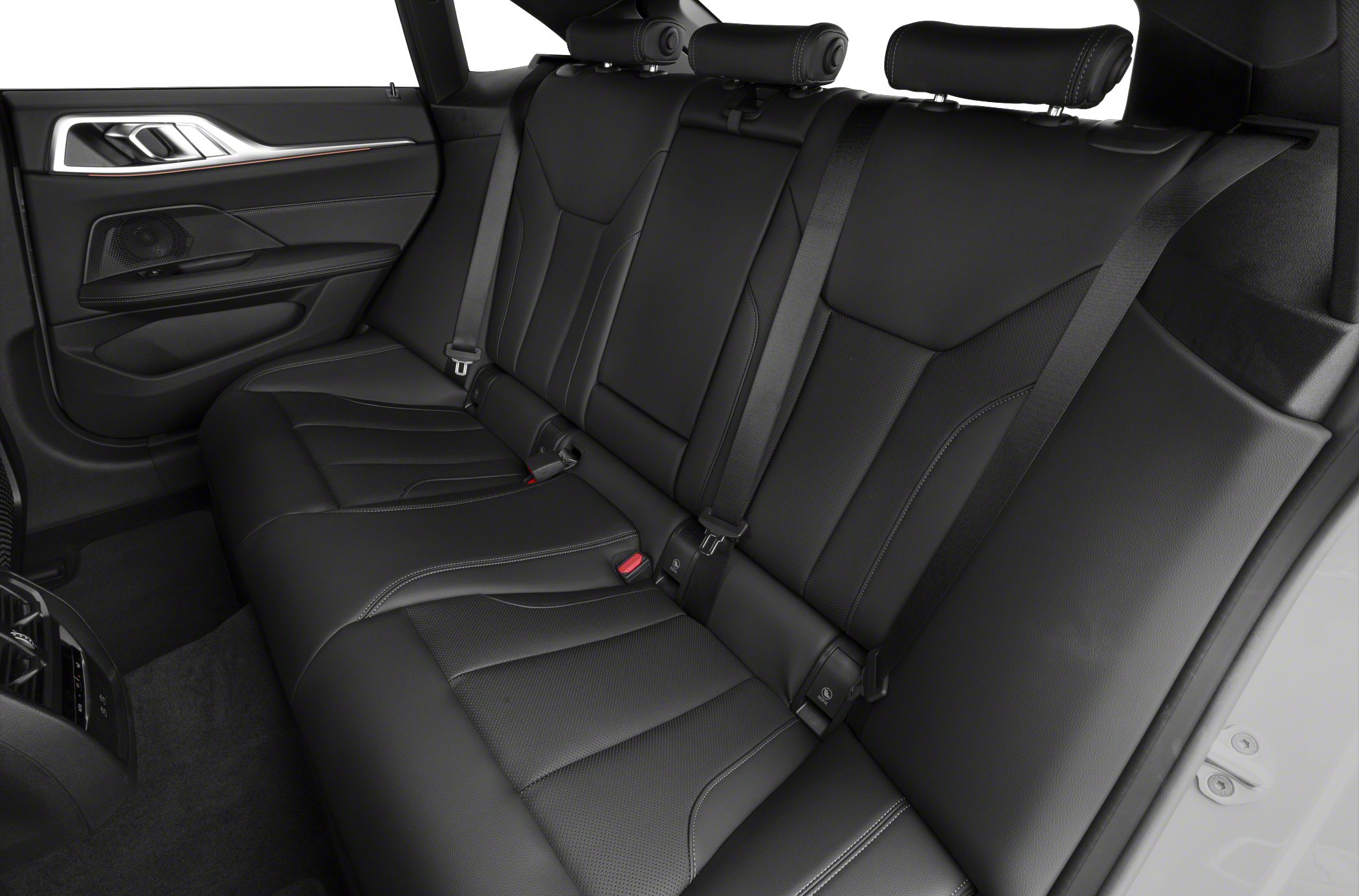Black leather rear seat interior with detailed stitching and seat belts