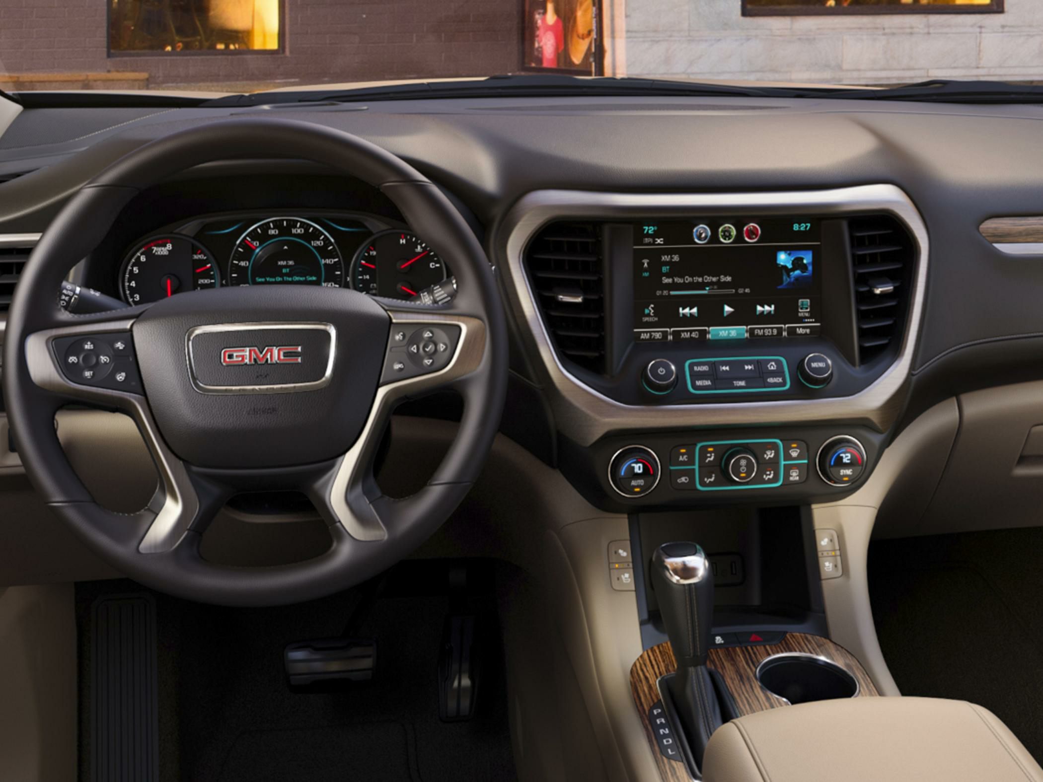 Steering wheel, dashboard, instrument cluster, infotainment screen, climate control, gear shift