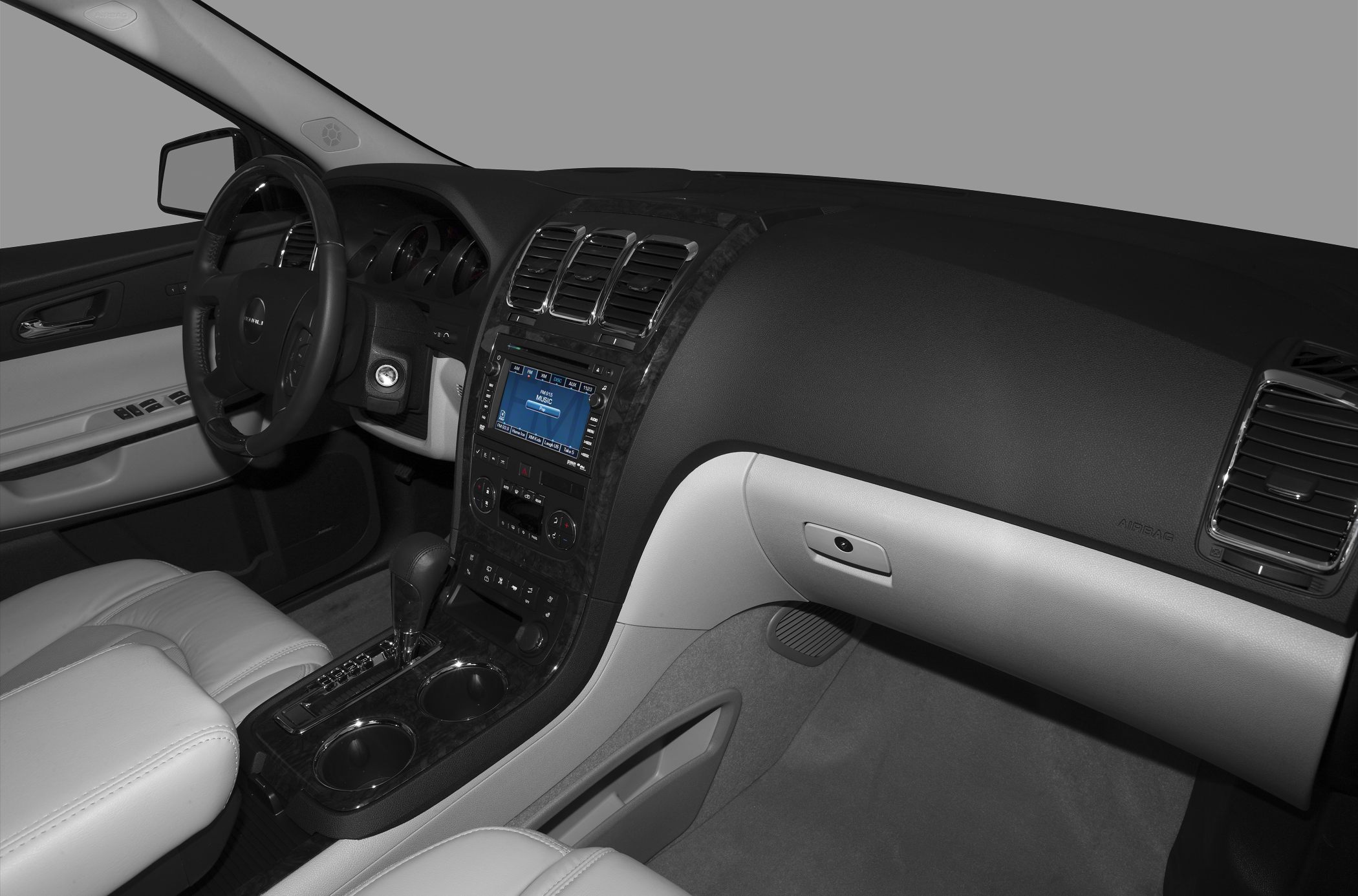Car dashboard and center console with infotainment system and gear shift