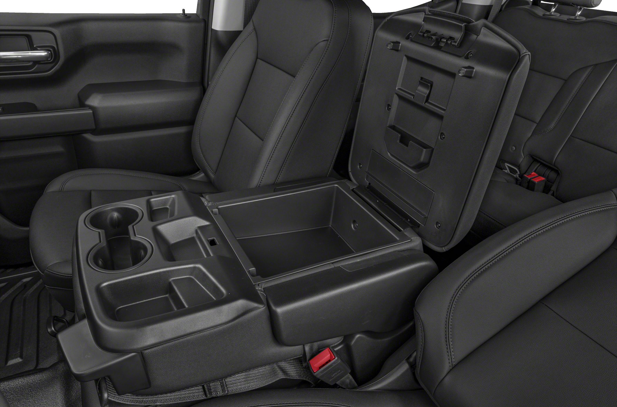 Center console with open storage and cup holders, black upholstery seating.