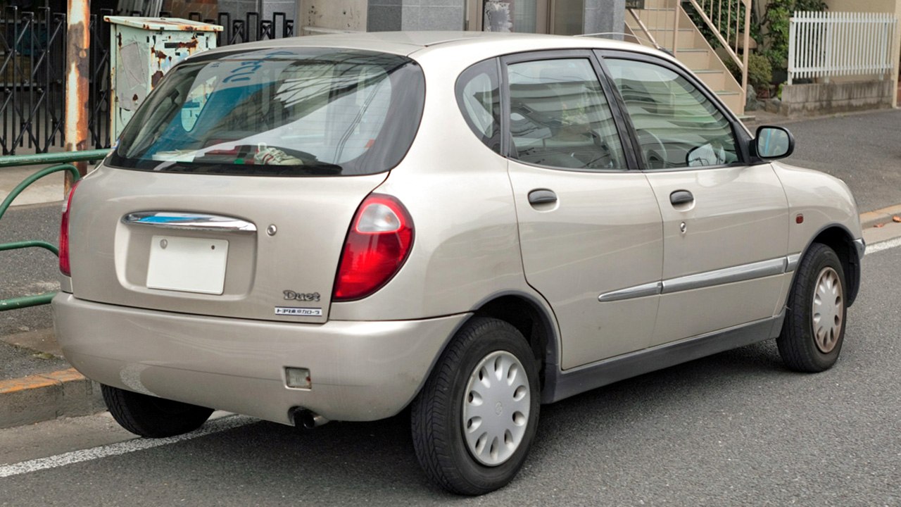 Rear three-quarter view of a compact hatchback with distinctive rear light design and five-door layout.