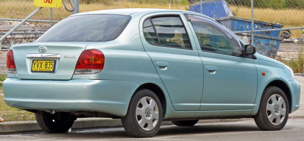 Rear side view of a compact sedan with distinct tail lights and door design