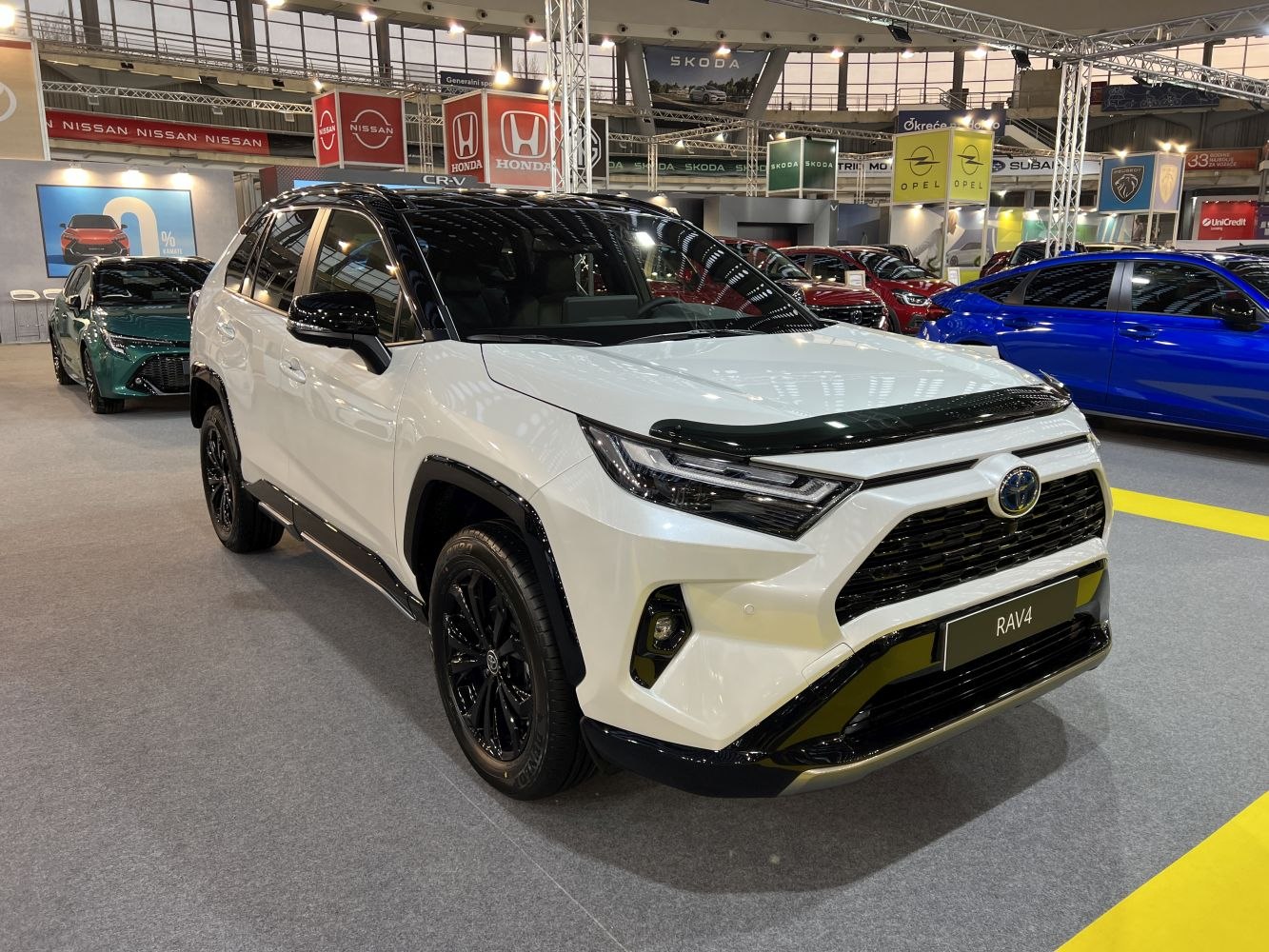 Front view of SUV with sleek headlights and black trim accents