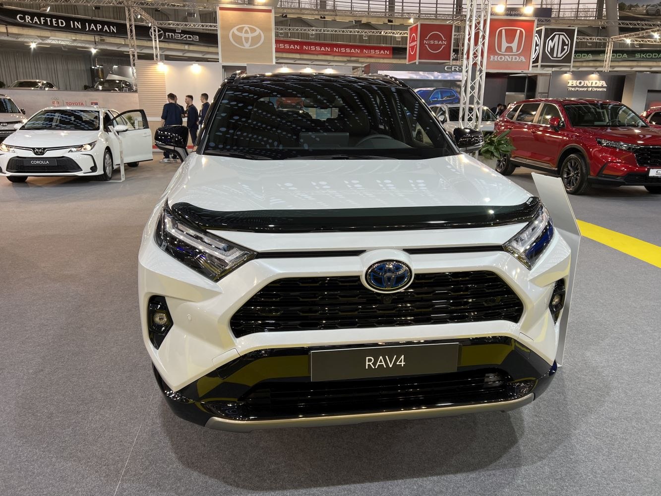 Bold grille and sharp LED headlights of a modern SUV front