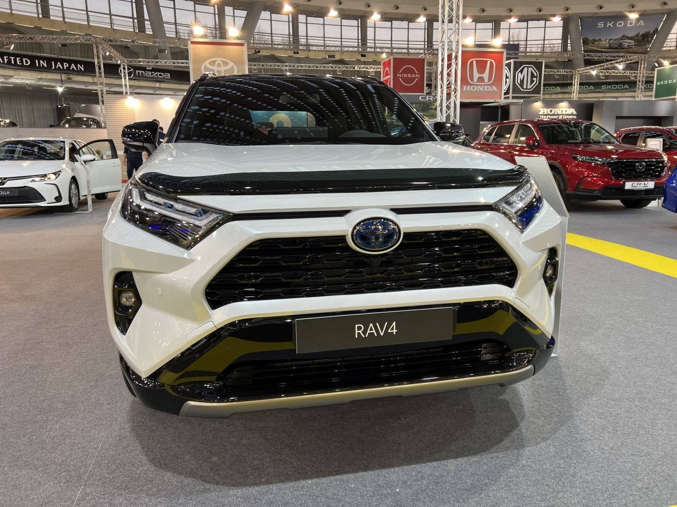 Bold front grille and sharp LED headlights of a white SUV