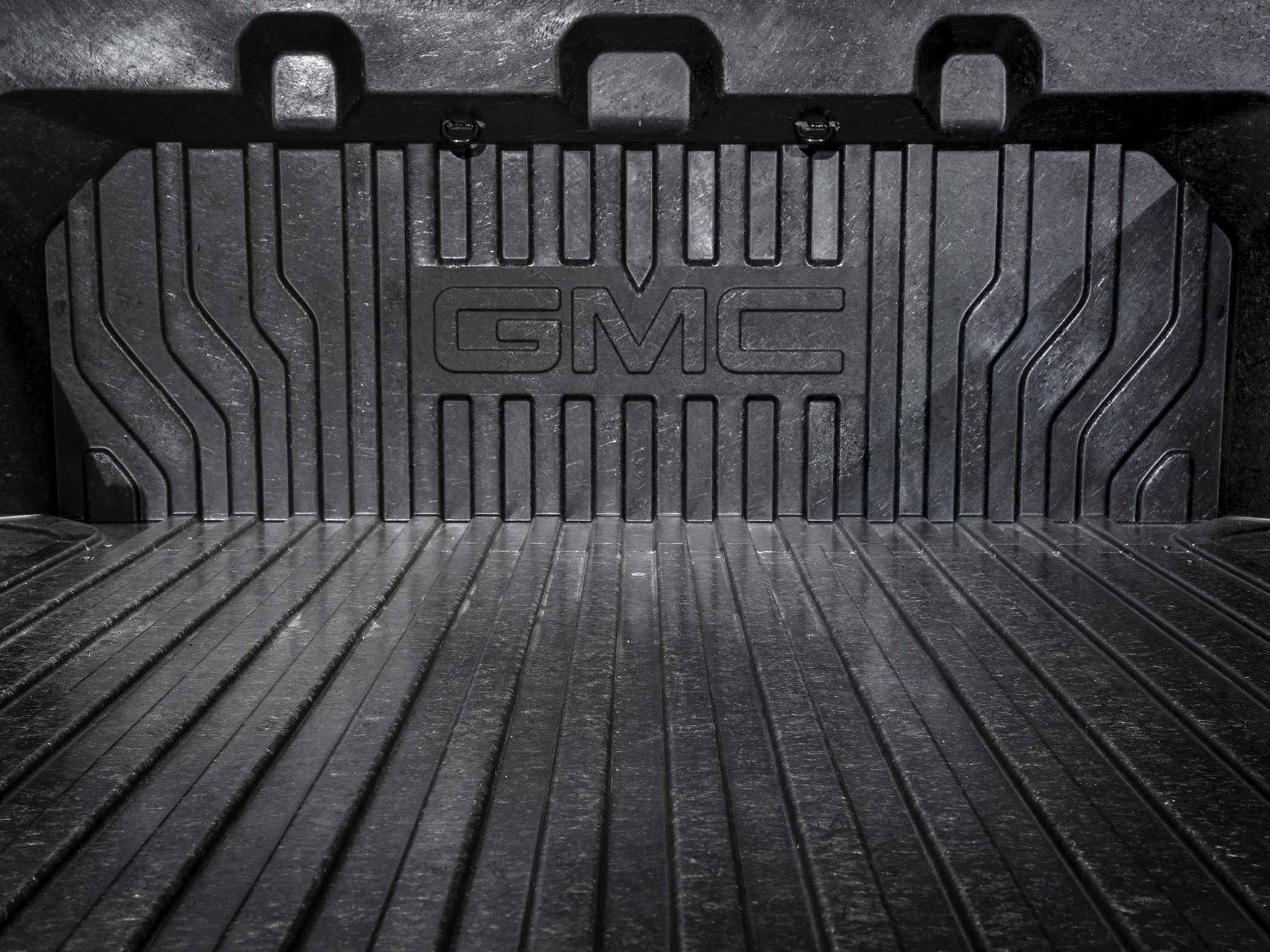 Durable GMC cargo bed liner with embossed logo