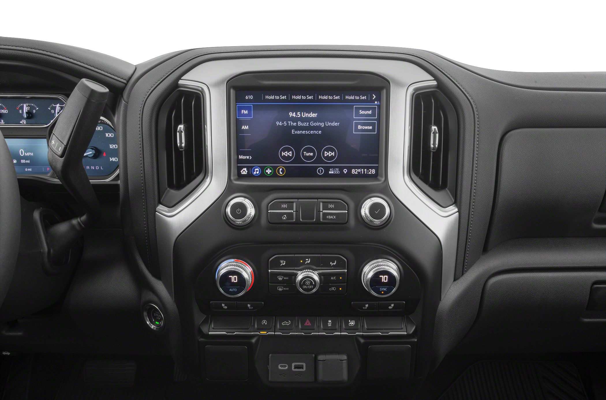 Touchscreen infotainment and climate controls on vehicle dashboard