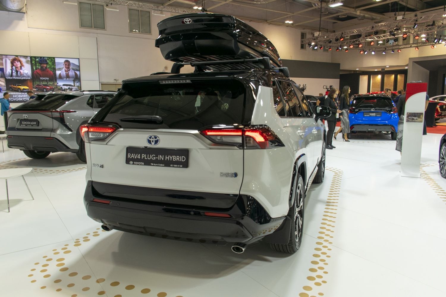 Rear view of SUV with LED tail lights and rooftop cargo box