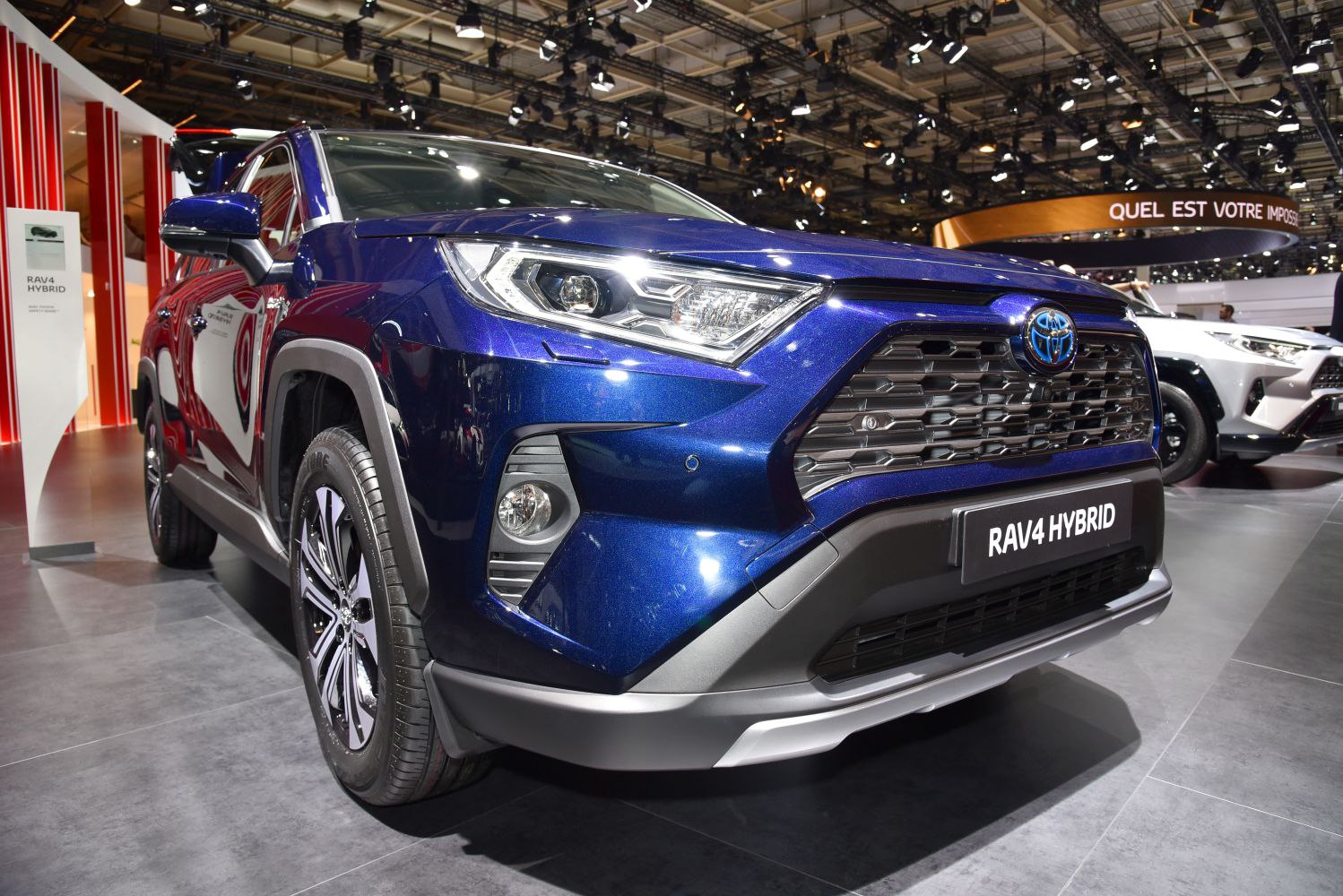Front view with LED headlights and grille of a hybrid SUV.