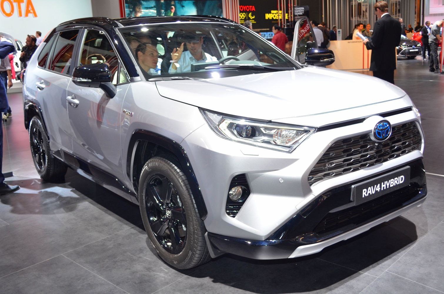 LED headlights and bold front grille with black alloy wheels on hybrid SUV