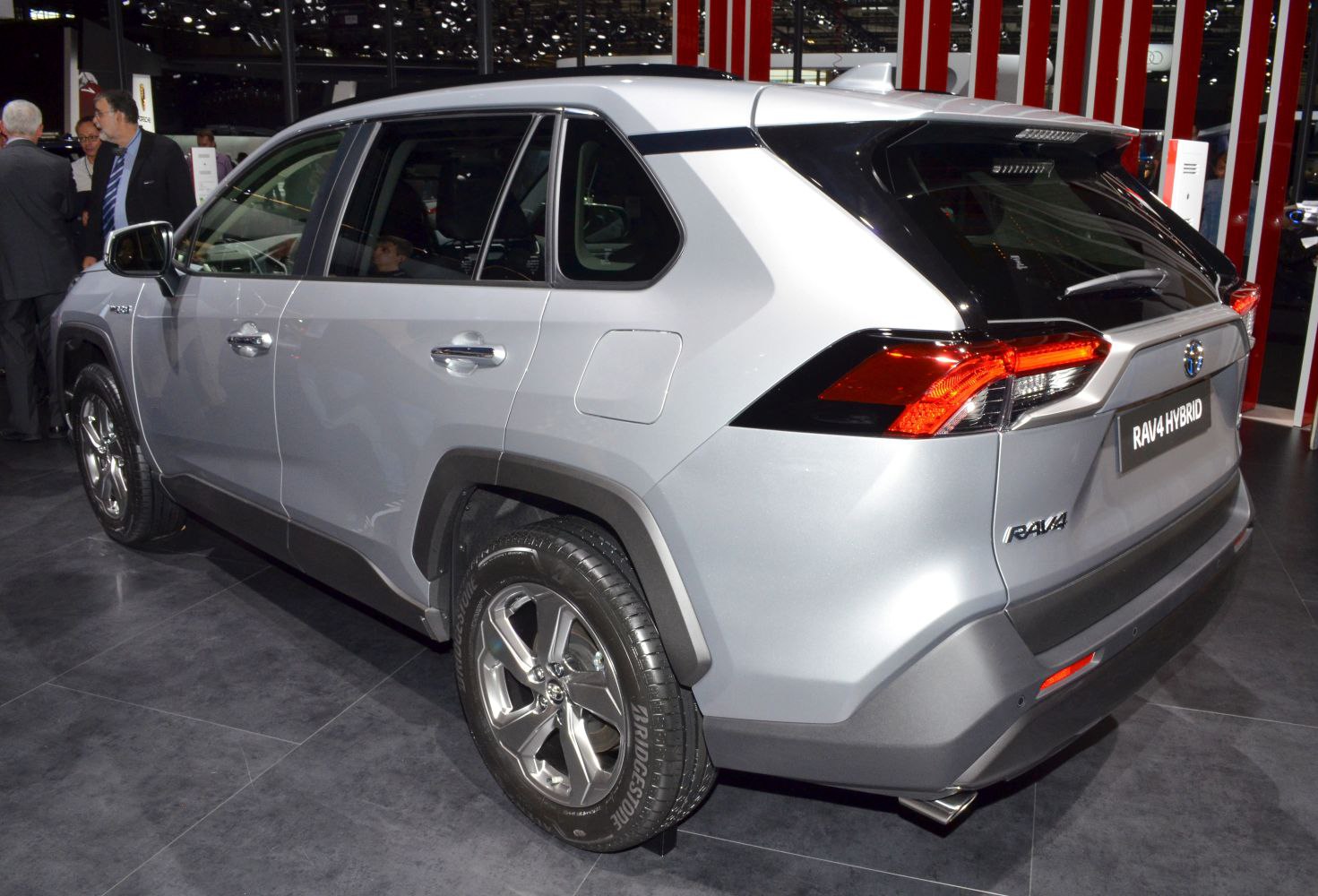 Rear side view with sharp taillights and prominent wheel arches