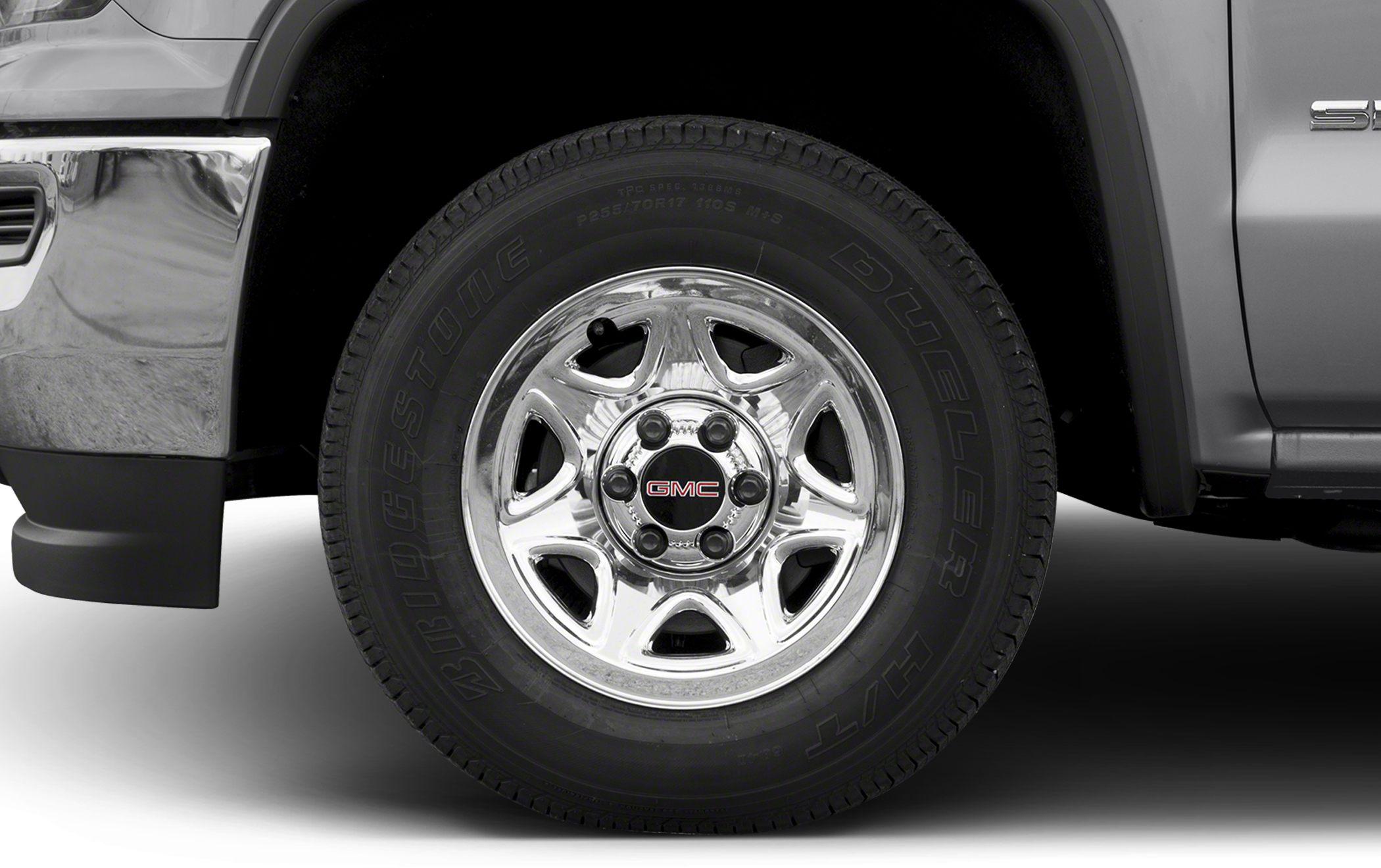 Close-up of a chrome alloy wheel with Bridgestone Dueler tire on a truck.