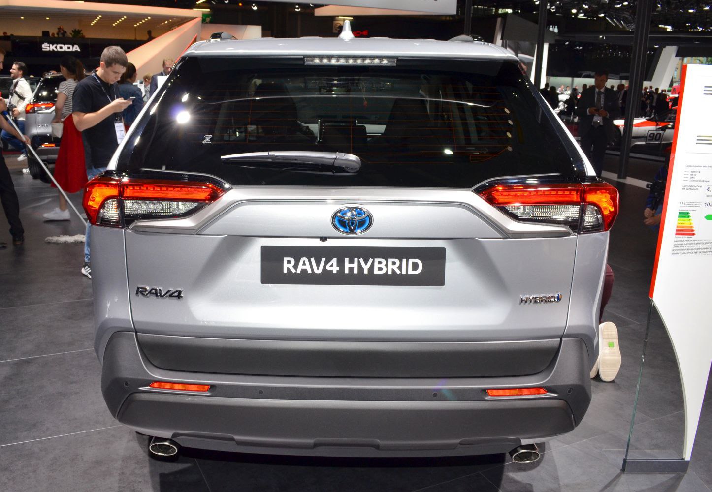Rear view of a hybrid SUV with distinct tail lights and dual exhaust pipes