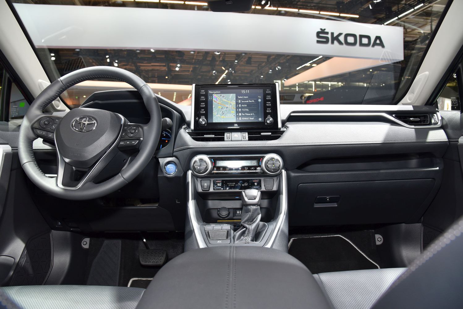 Multifunction steering wheel and touchscreen navigation with climate control.