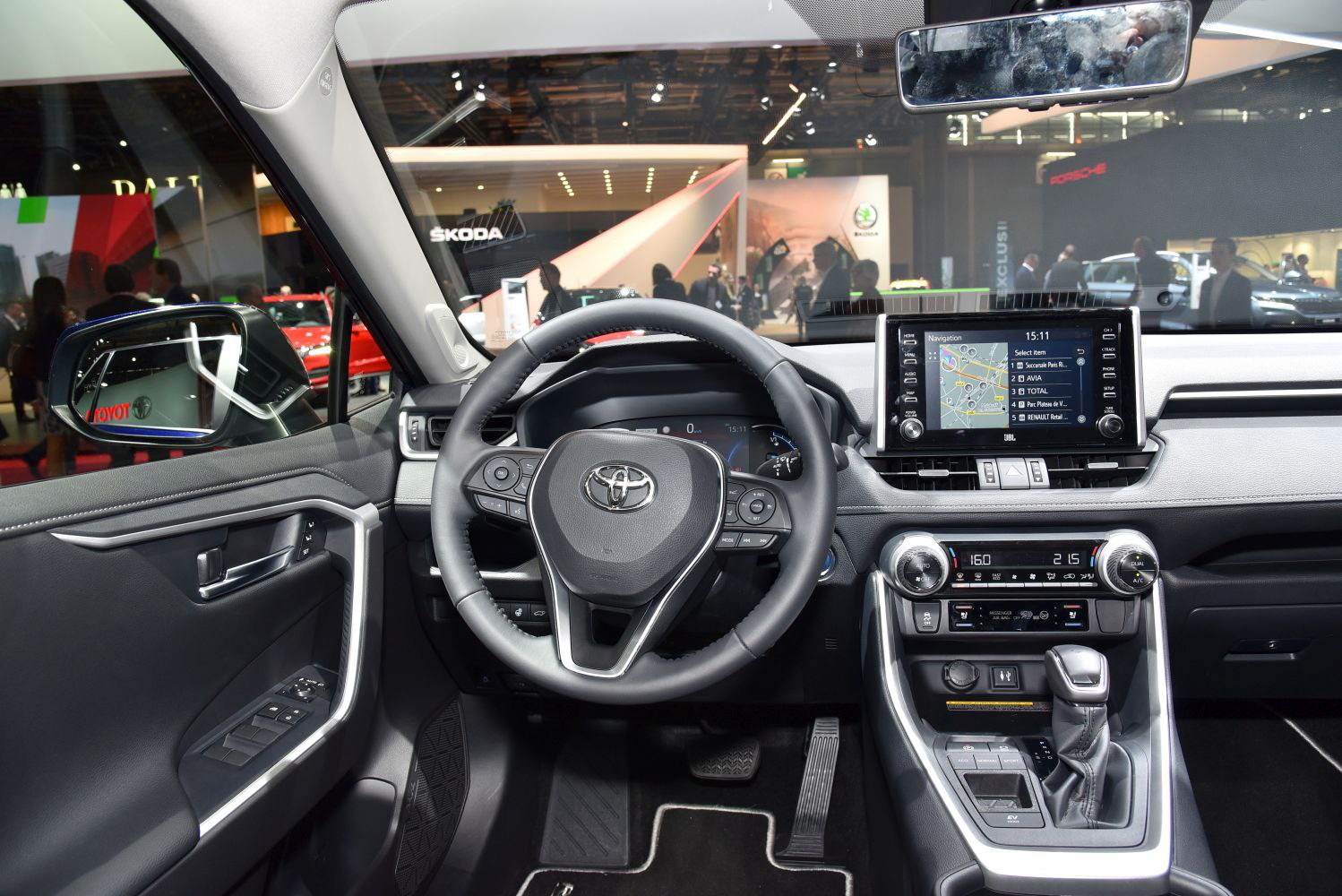 Modern car interior with steering wheel and touchscreen navigation