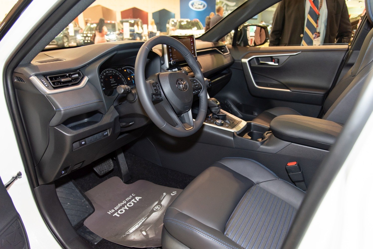 Modern car interior with dashboard and steering wheel view
