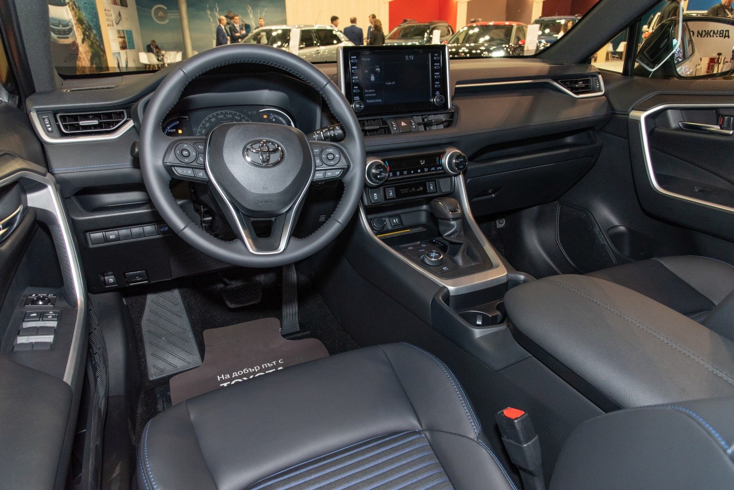 Interior dashboard and steering wheel with center console and controls