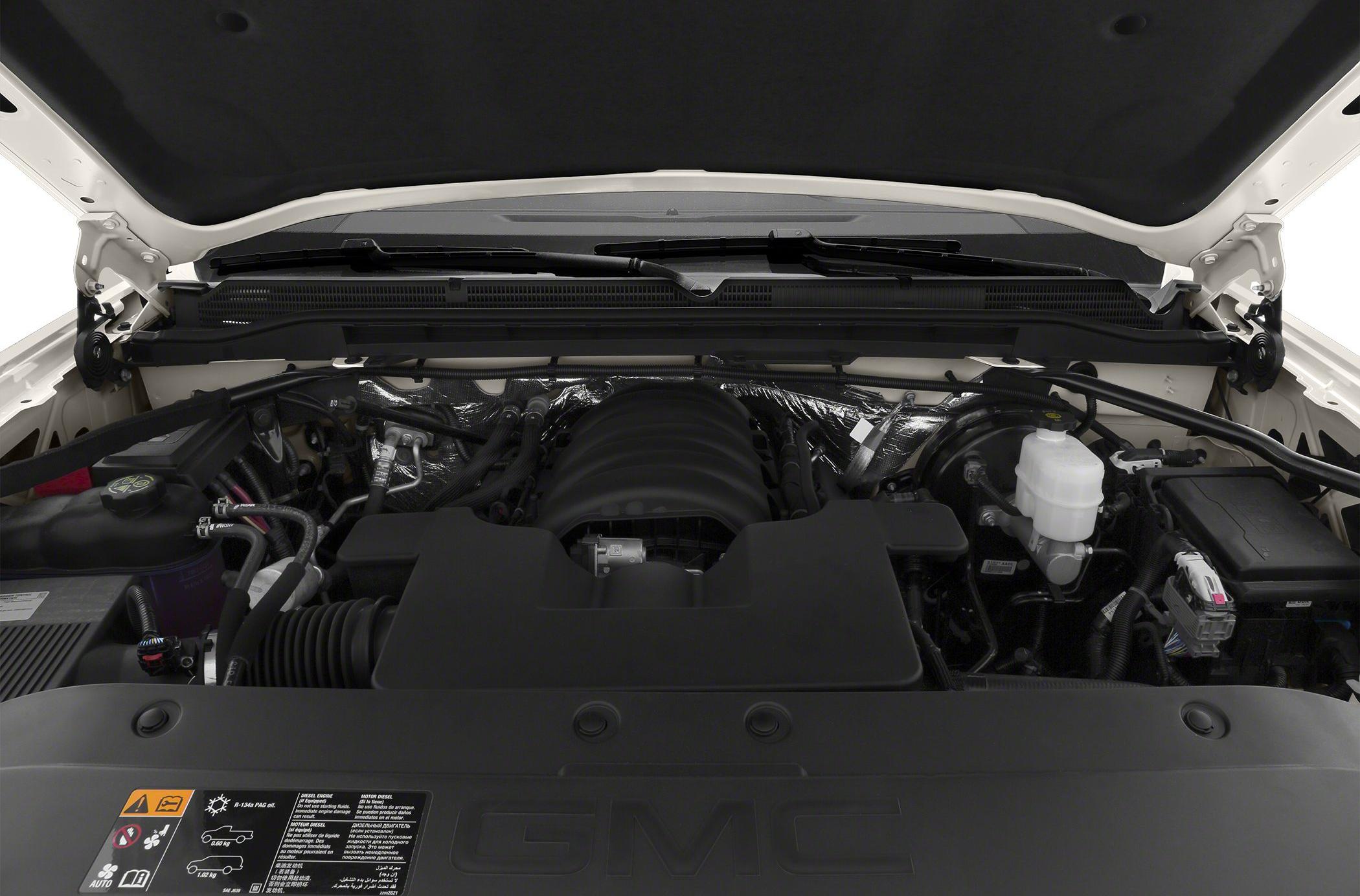 Engine bay with a clean layout and prominent engine cover under the hood