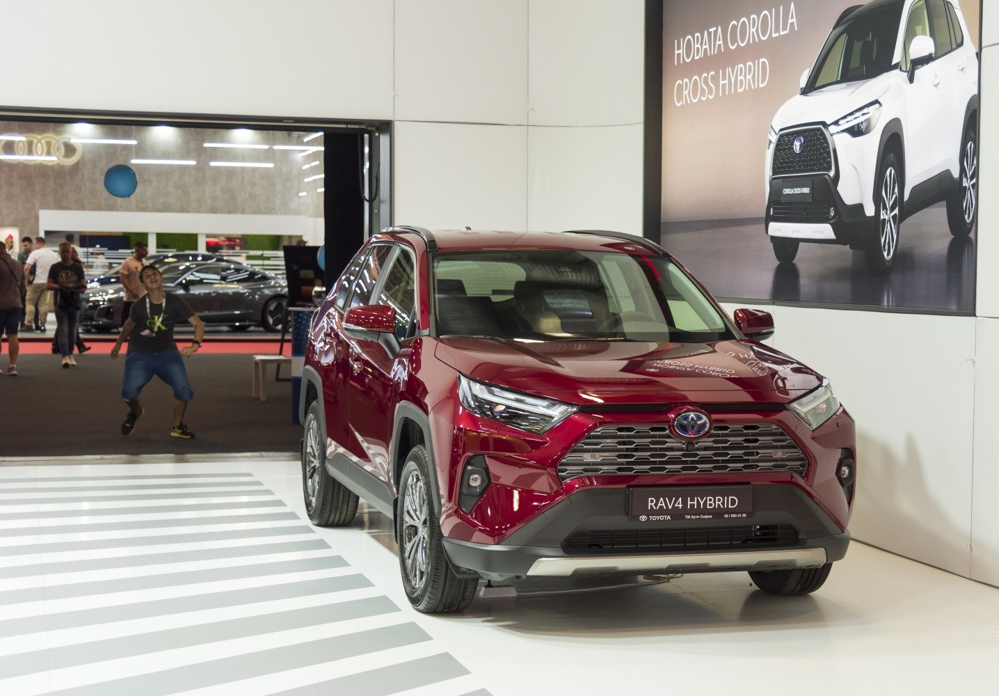 Front view of hybrid SUV with detailed grille and sleek headlamps