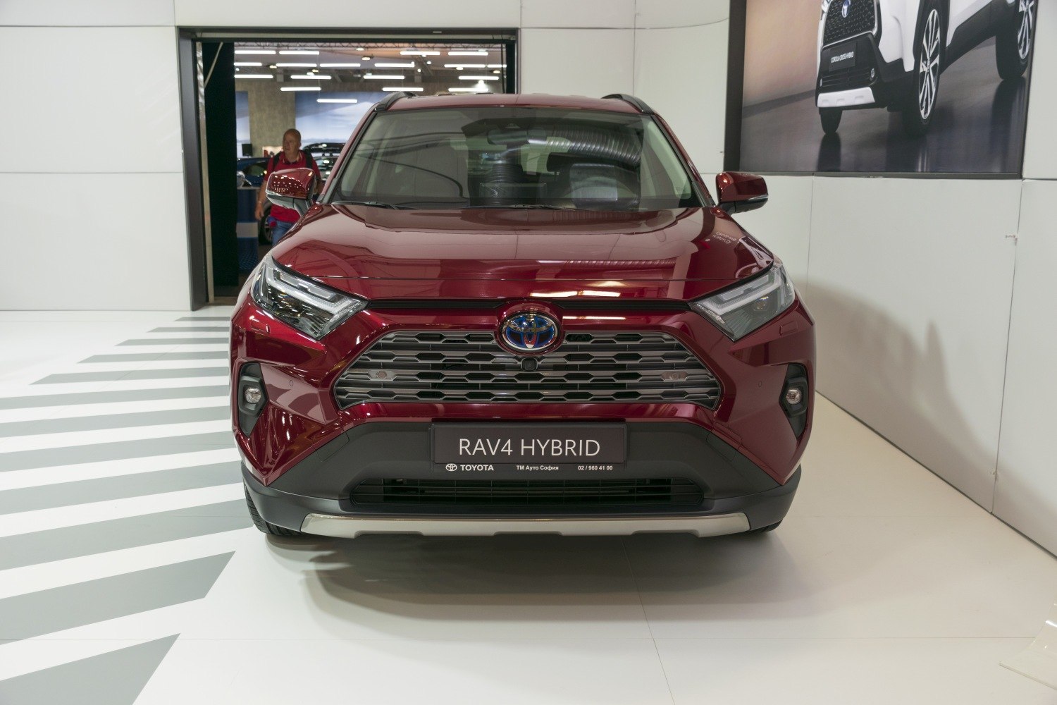 Front view of hybrid SUV with hexagonal grille and LED headlights