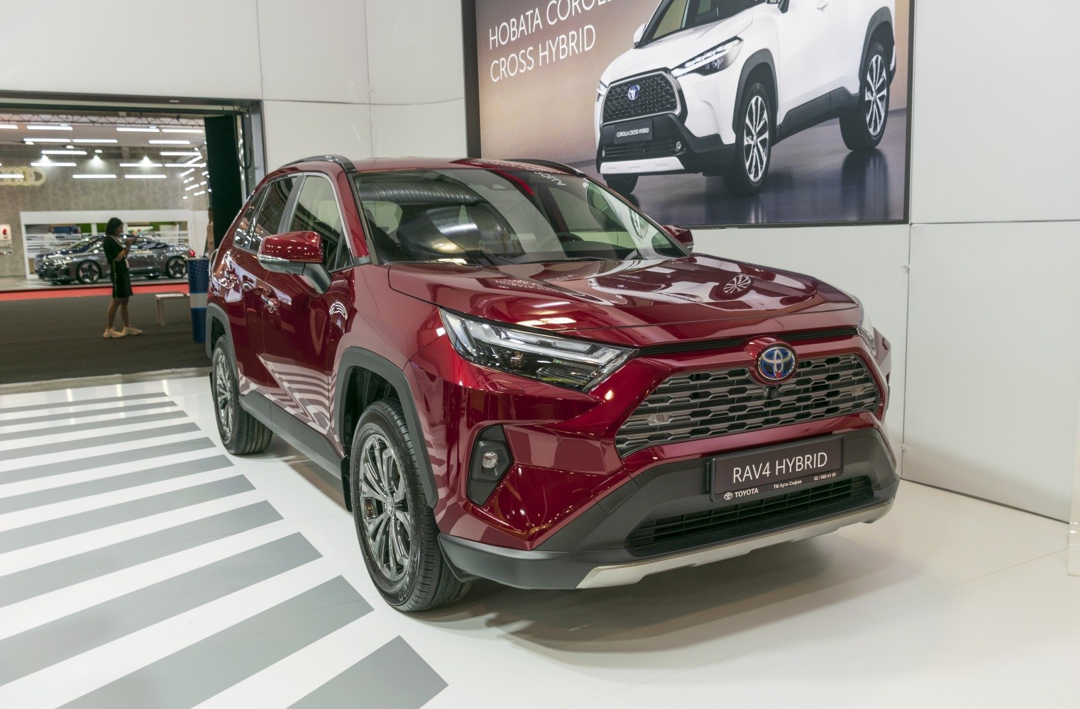 Front view with sharp headlights and large grille on hybrid SUV
