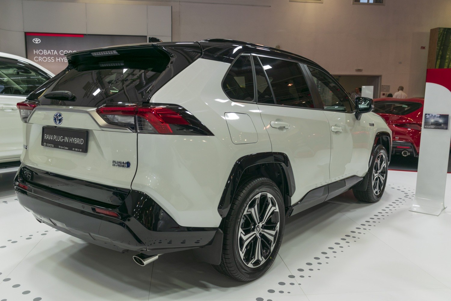 Rear and side view of a plug-in hybrid with distinct taillights and alloy wheels