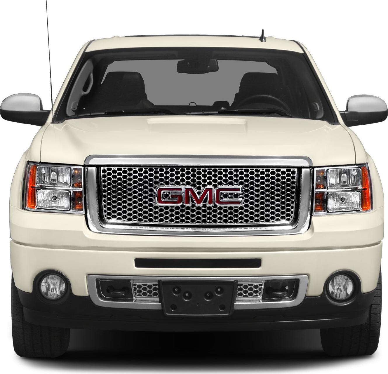 Front view with large mesh grille and rectangular headlights