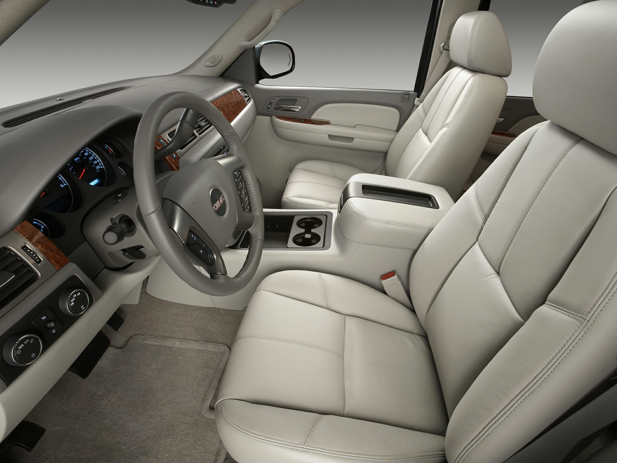 Leather seats, wood trim, modern dashboard, cup holders