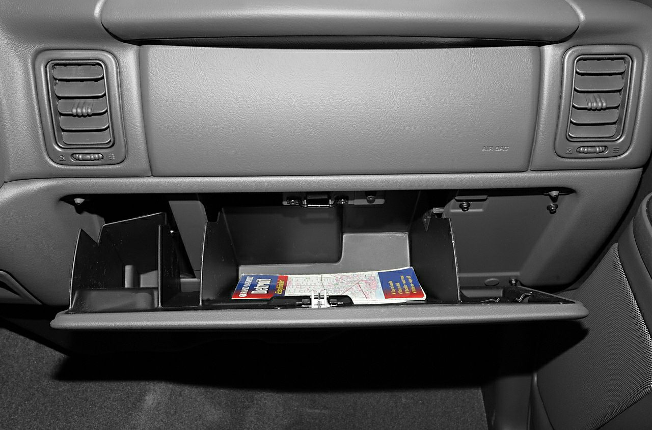 Open glove compartment with dashboard air vents