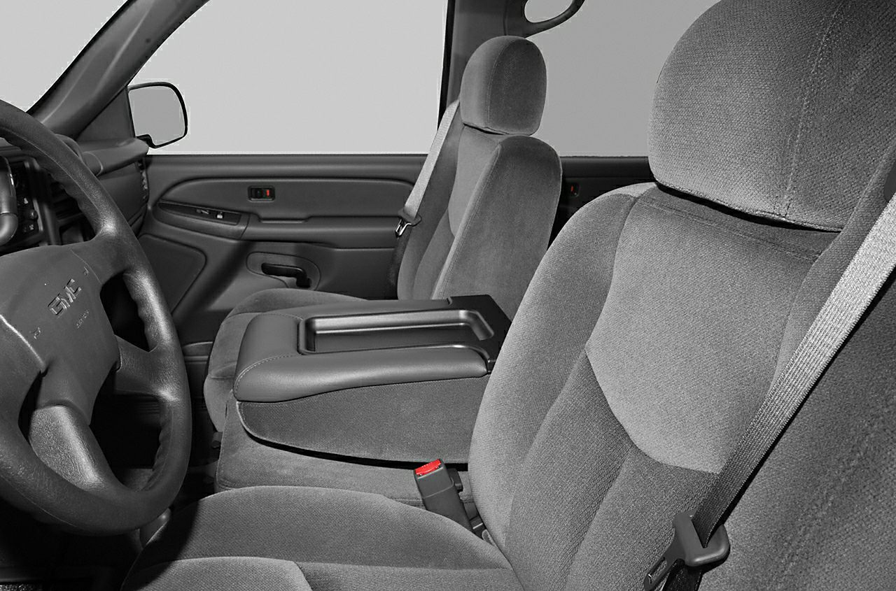 Truck interior with fabric seats, center console, and steering wheel