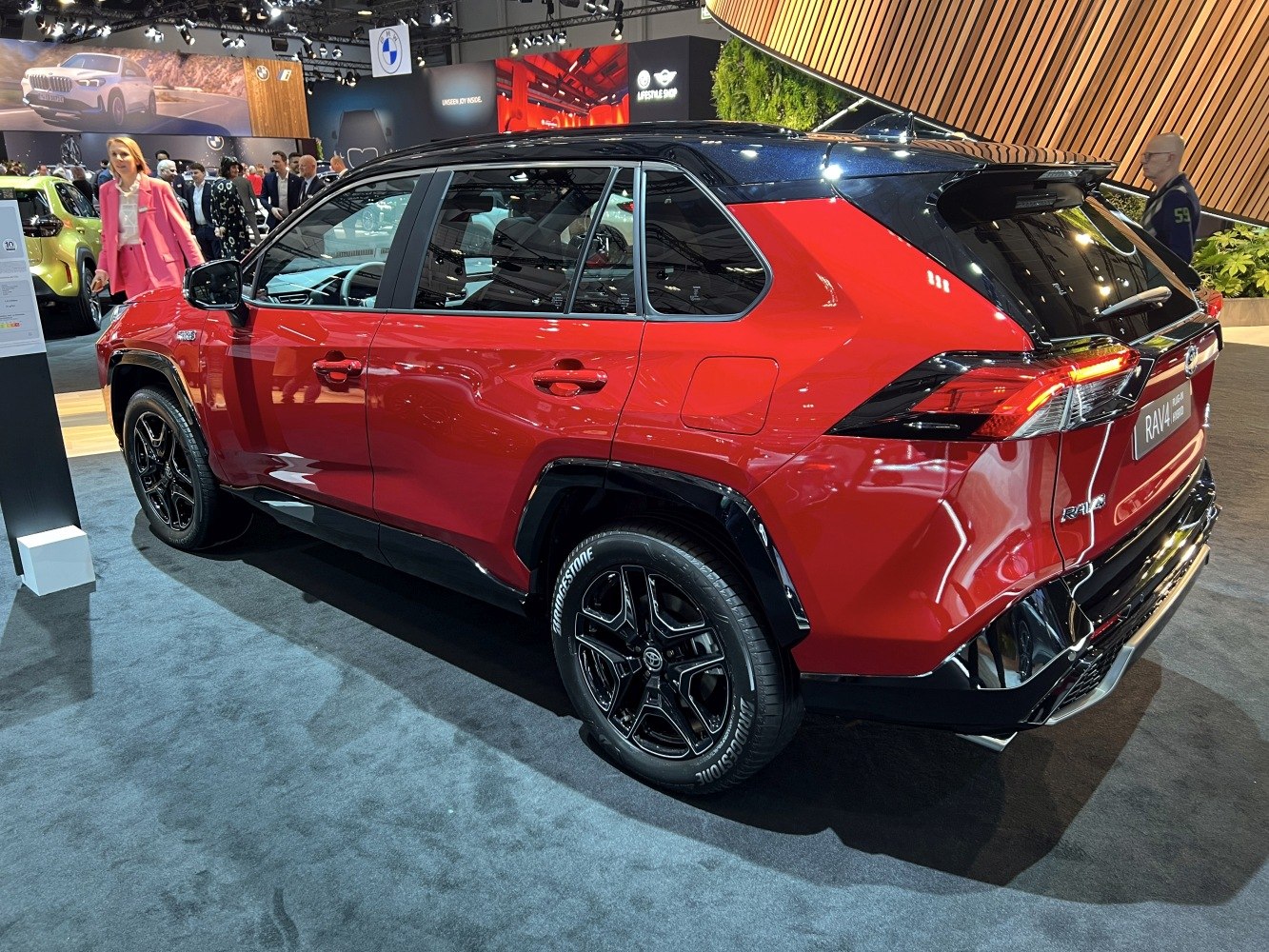 Red SUV rear side view with black roof and stylish wheels