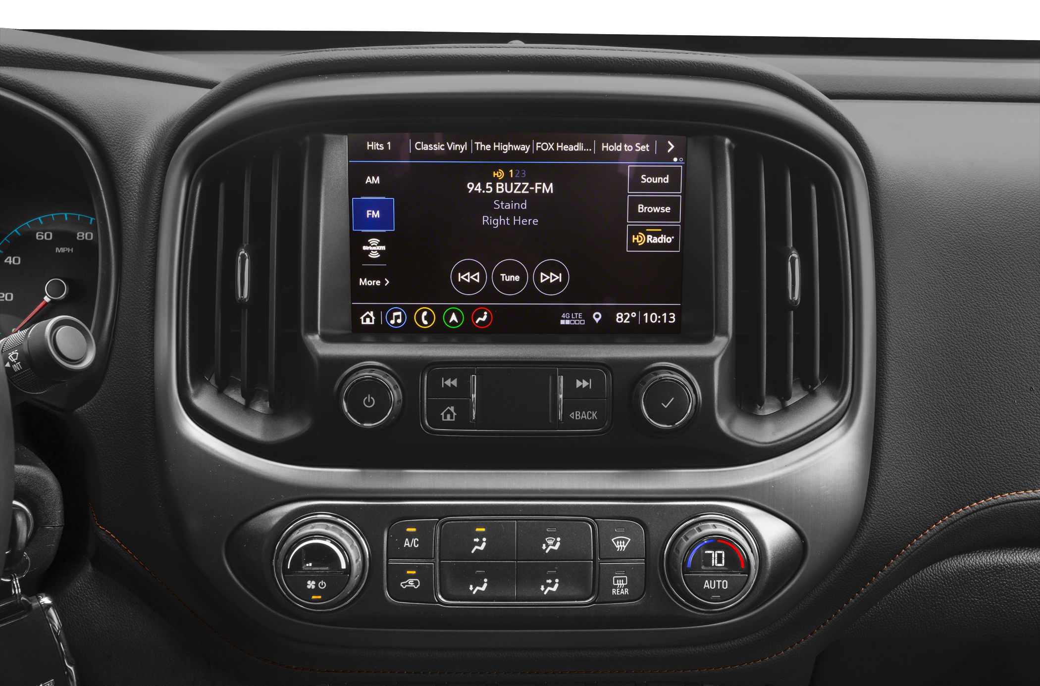 Infotainment screen and HVAC controls with dials and buttons