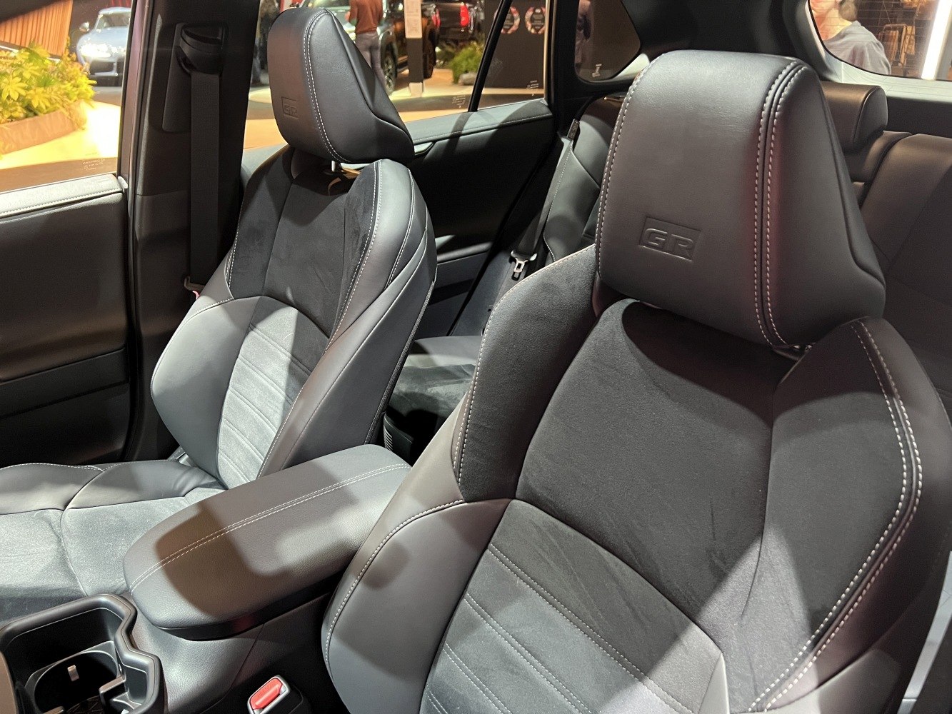 Luxury front seats with leather and suede, featuring GR embossed logo
