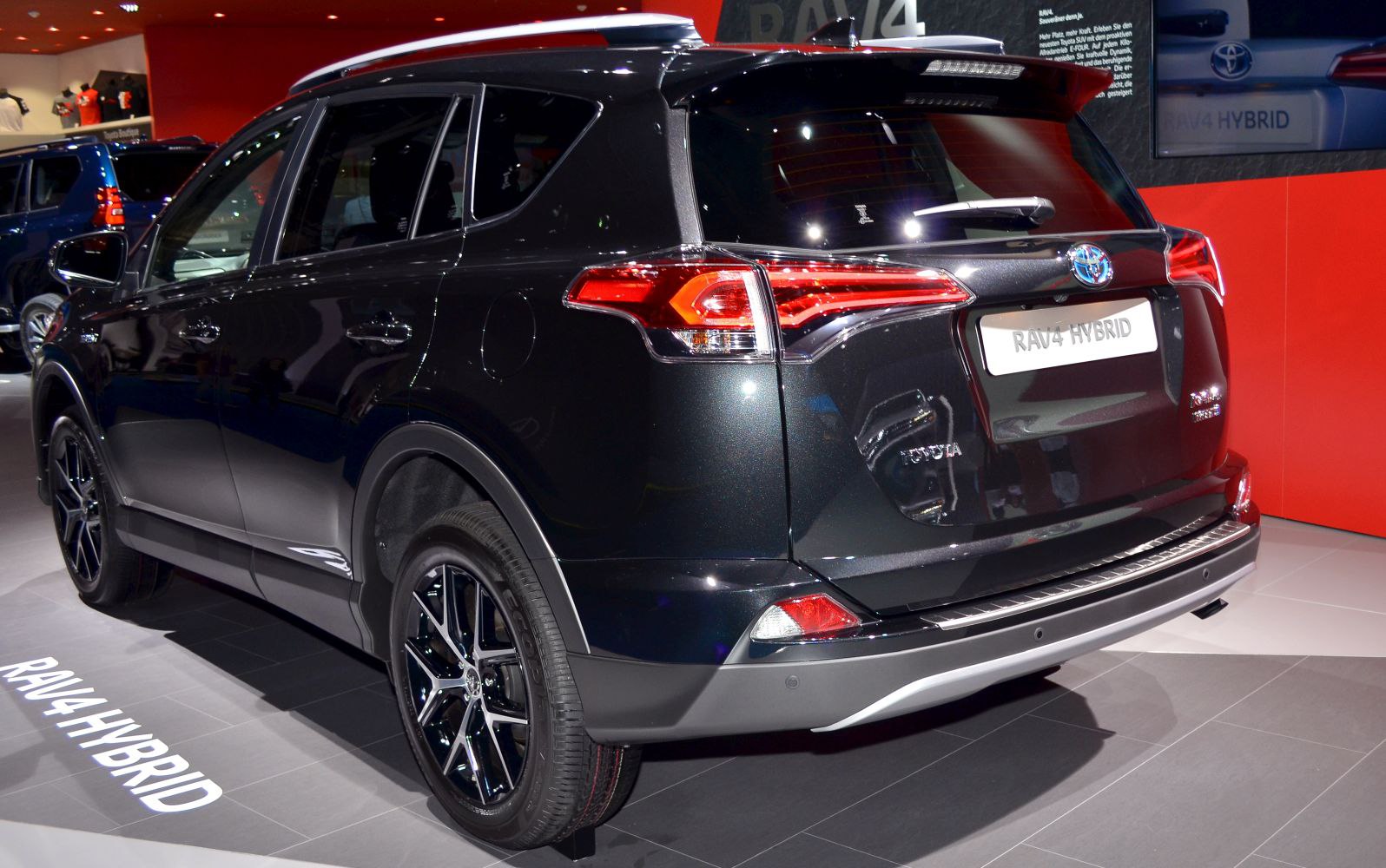 Rear view of SUV with hybrid badge and modern tail lights