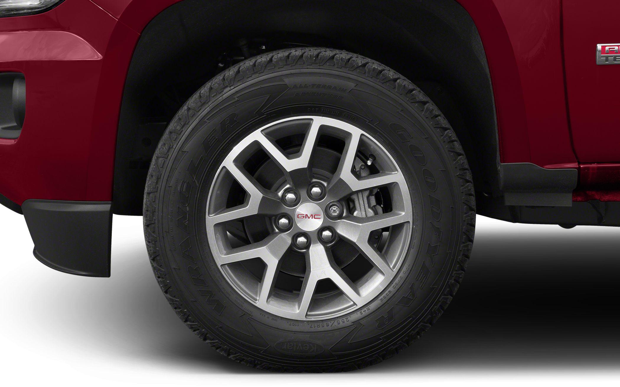 Alloy wheel with Goodyear Wrangler tire on pickup.