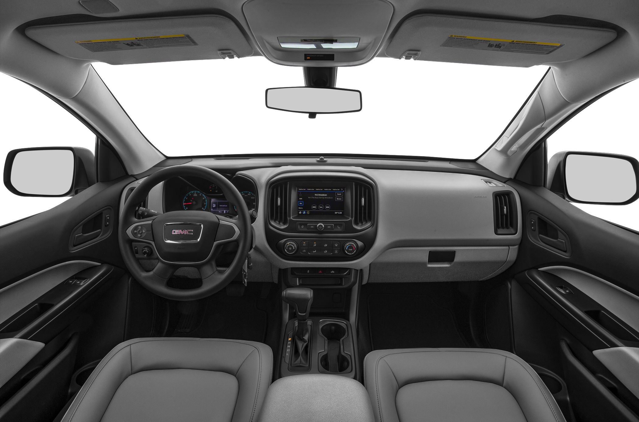 Truck interior with dashboard, steering wheel, and central console