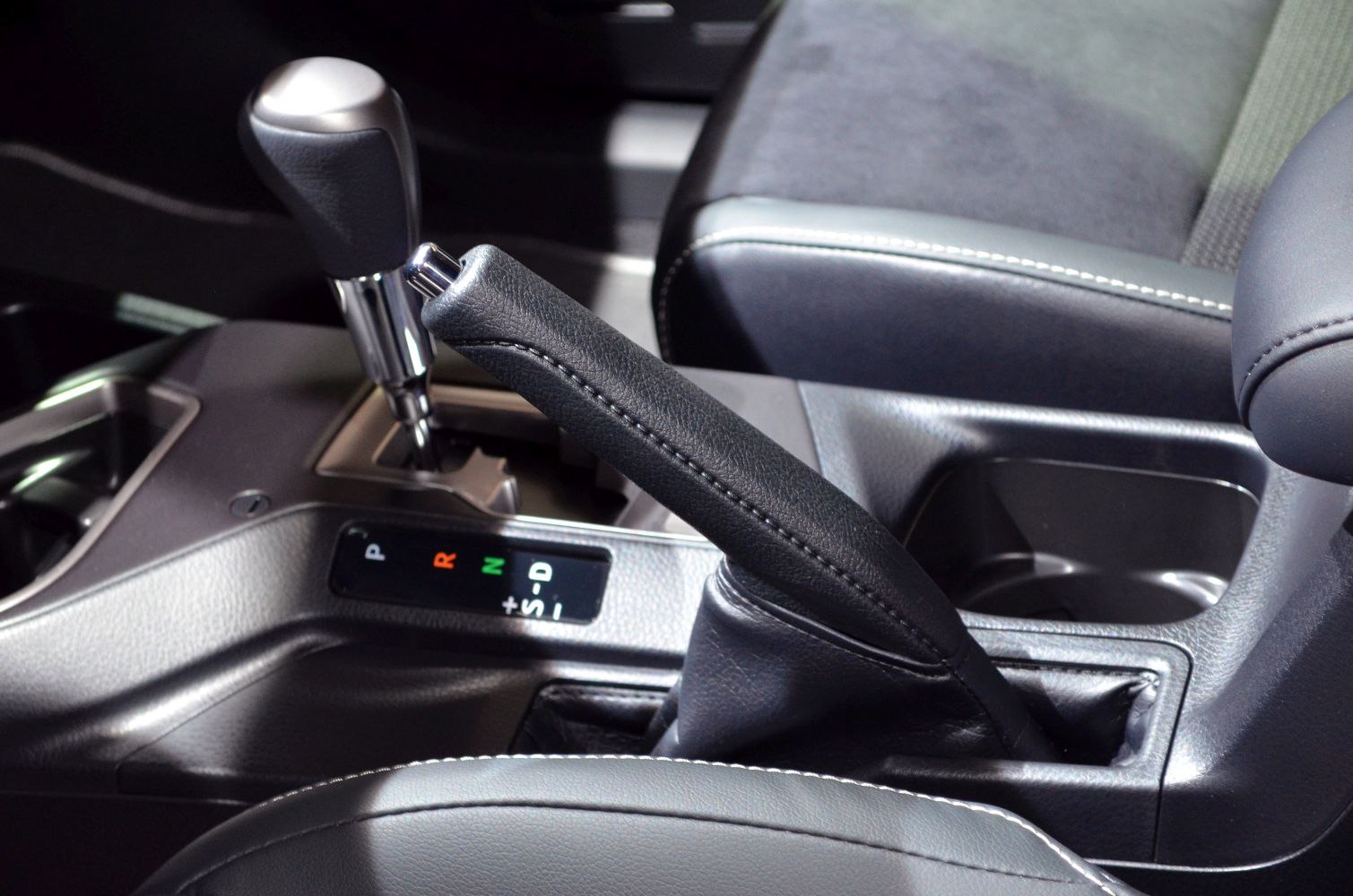 Gear shift lever and handbrake of a car center console