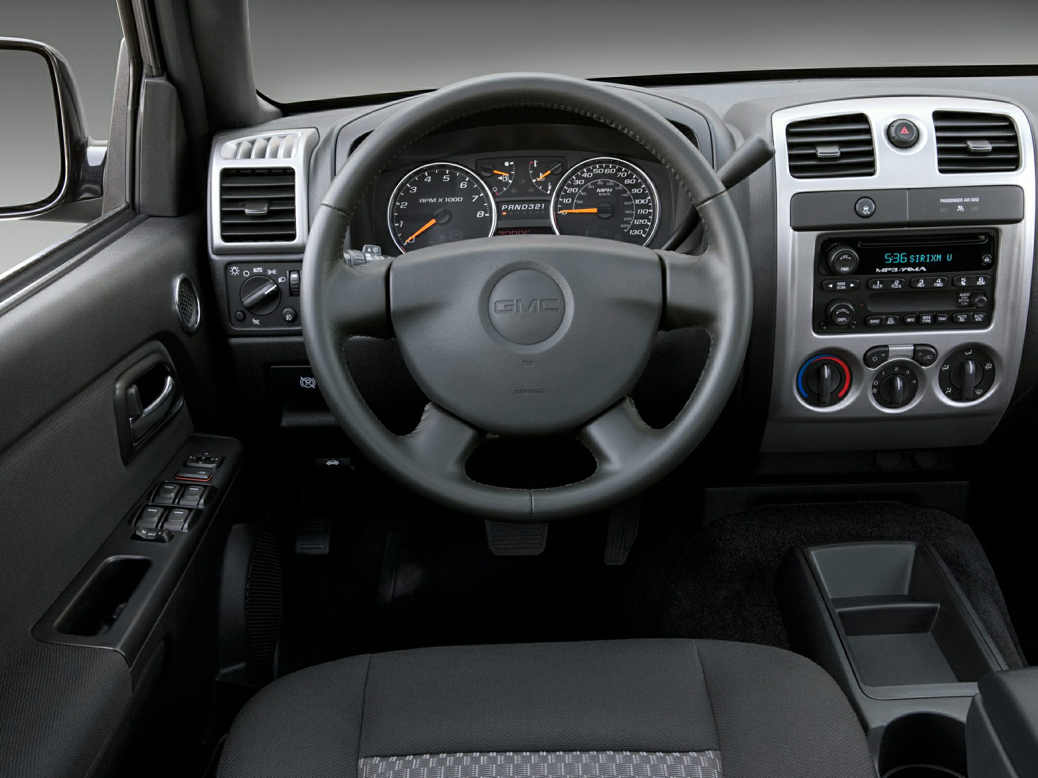 Dashboard and steering wheel with instrument cluster and control panel