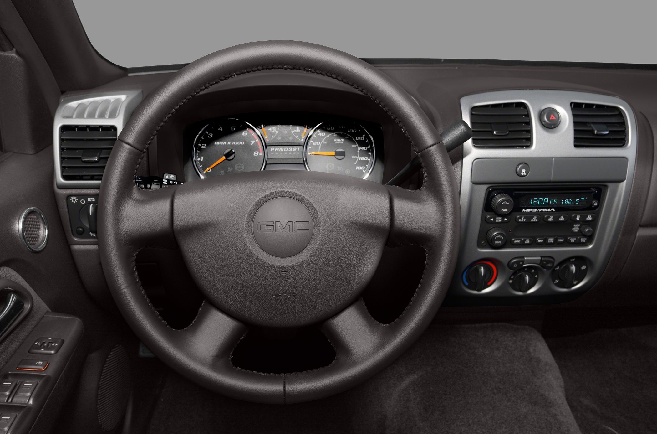 Steering wheel, analog gauges, dashboard controls layout