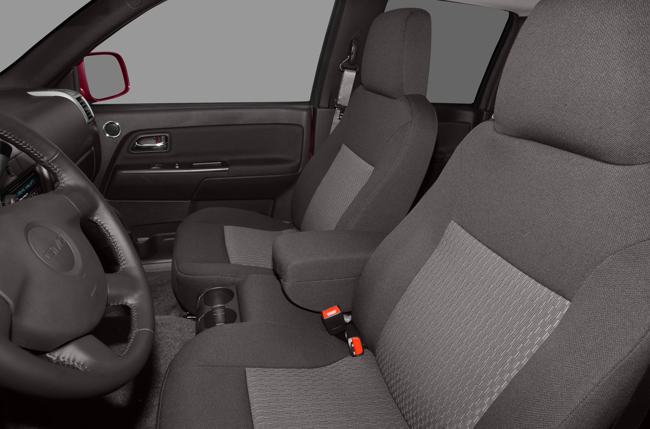 Fabric front seats and steering wheel inside vehicle cabin