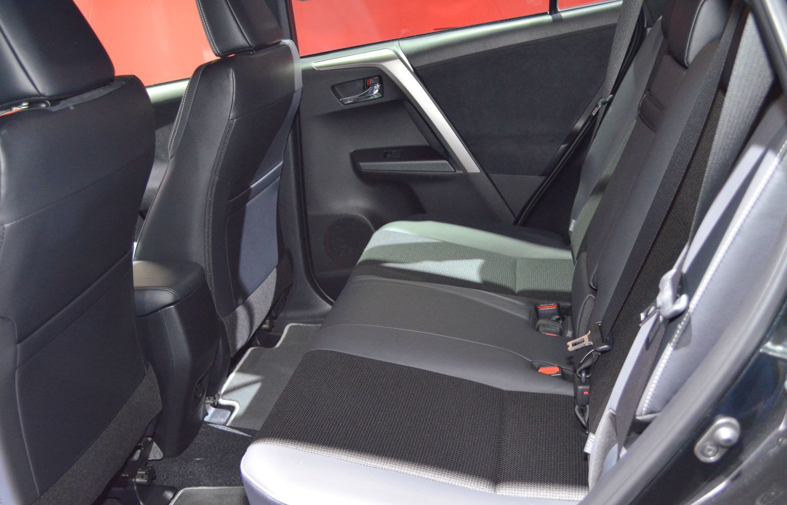 Rear seat with fabric upholstery and seatbelts in compact SUV interior