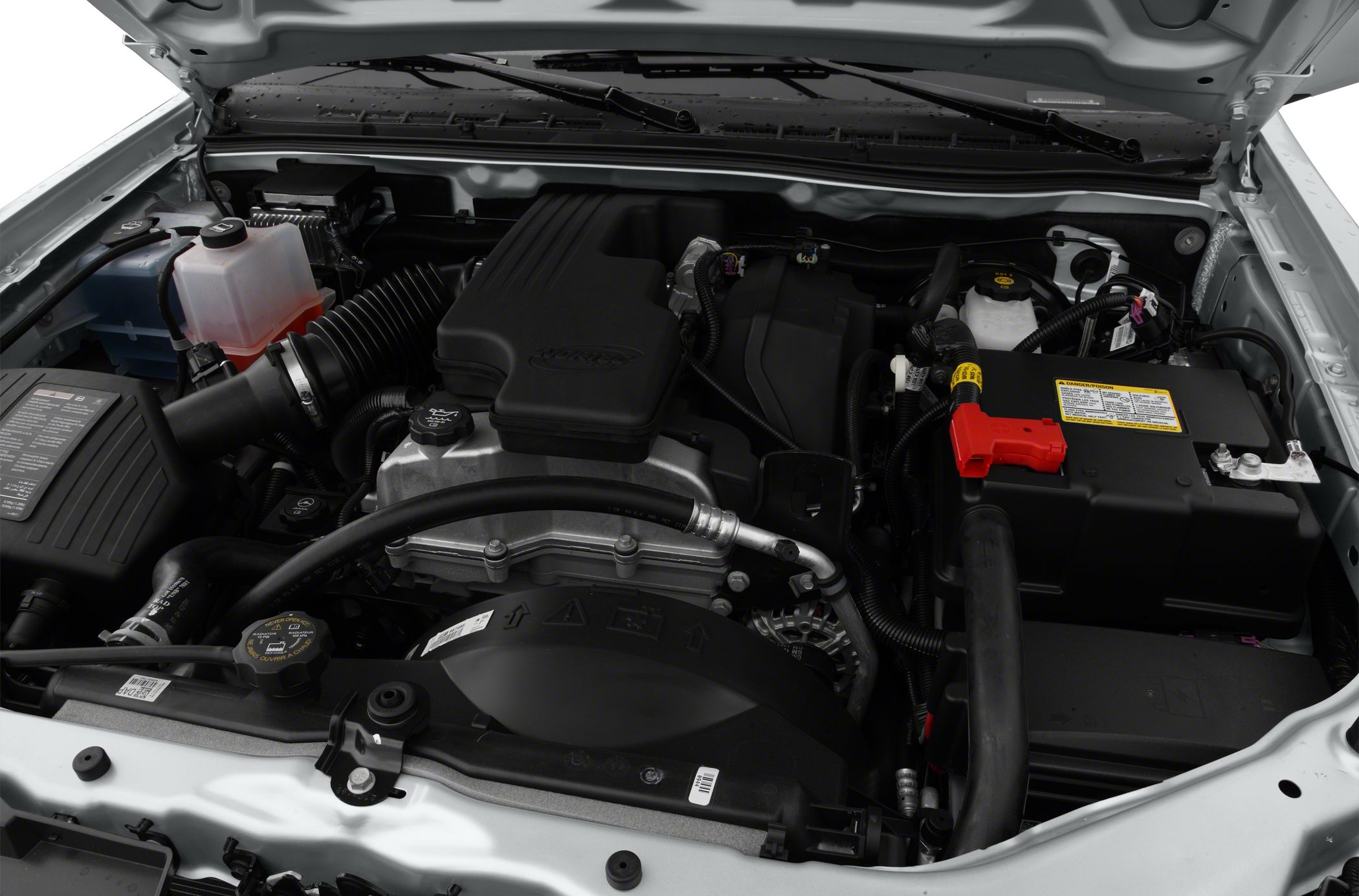 Engine bay with air intake, battery, and fluid reservoirs