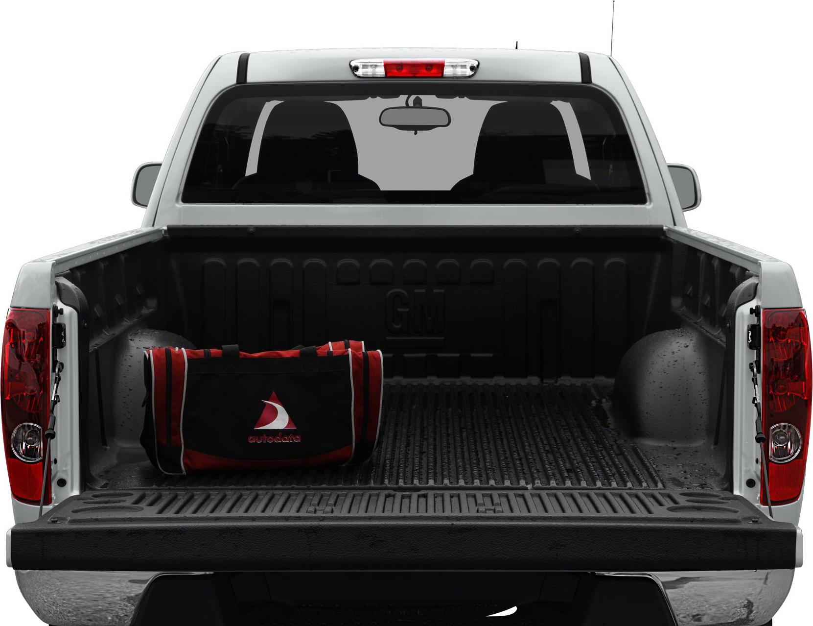 Open pickup truck bed with liner and red-black bag