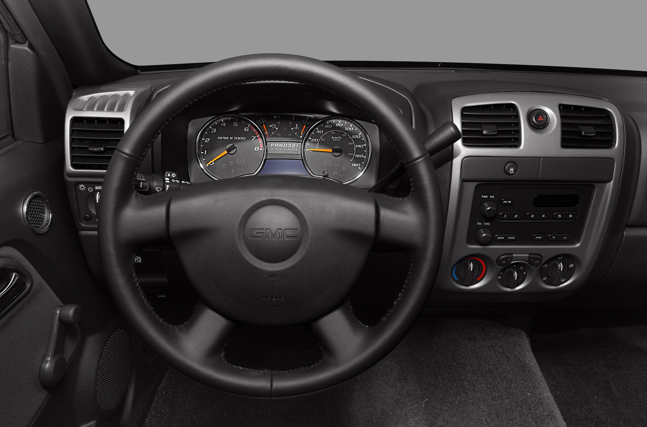 Dashboard and steering wheel with manual window controls