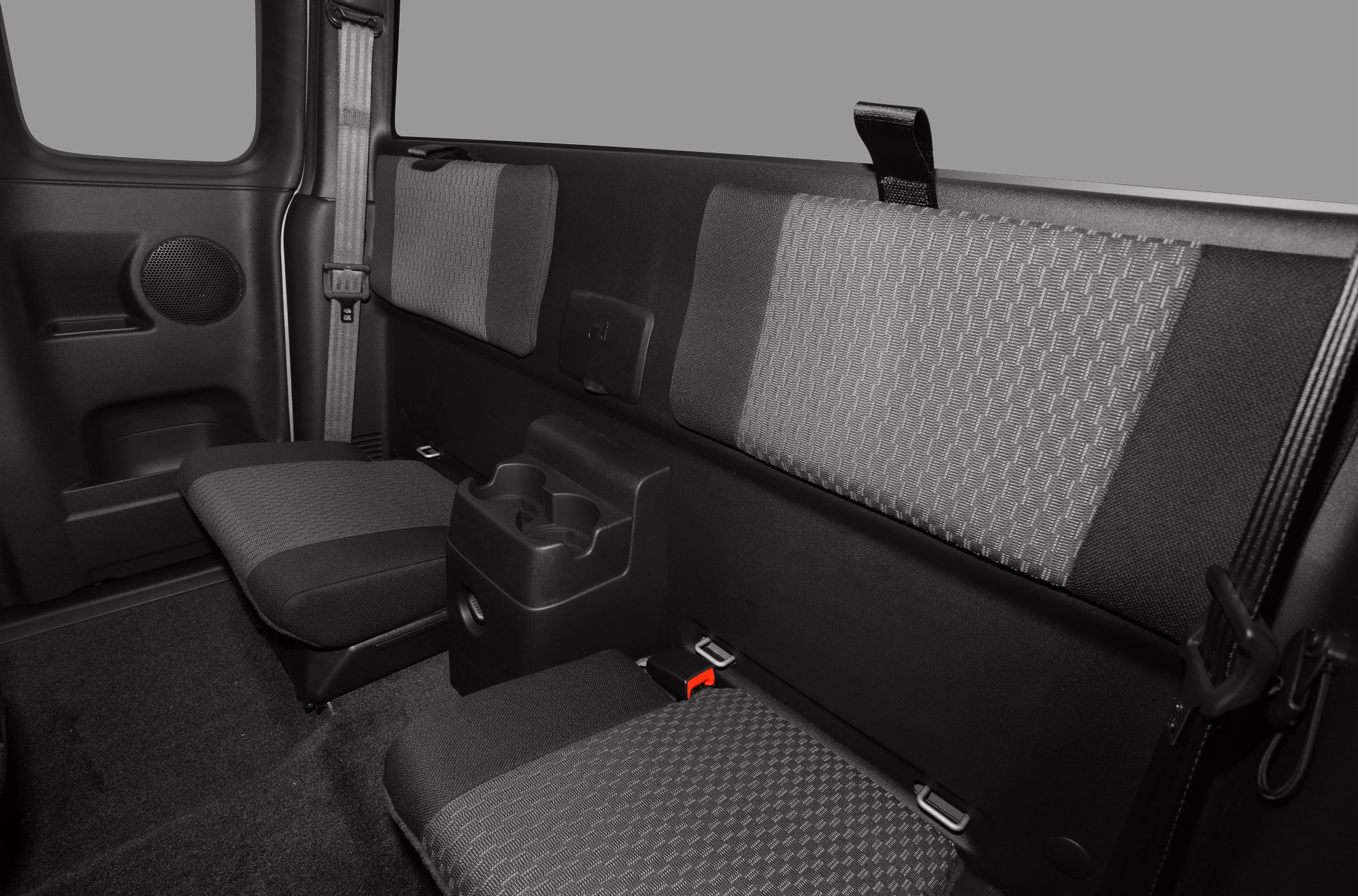Extended cab rear seating with fabric upholstery and cup holders